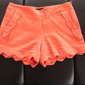 Orange scalloped pocket and edges shorts
